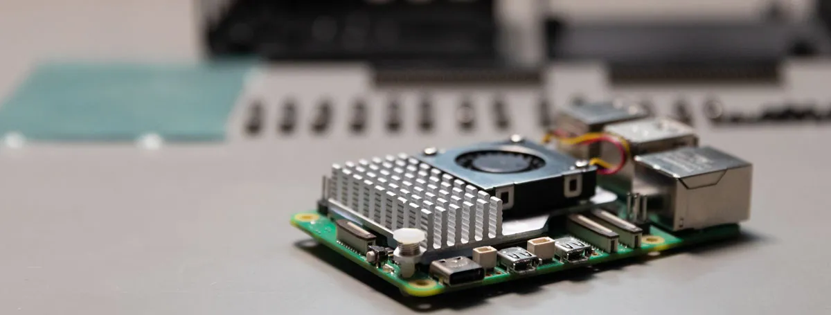 Raspberry Pi 5 in front of the disassembled case
